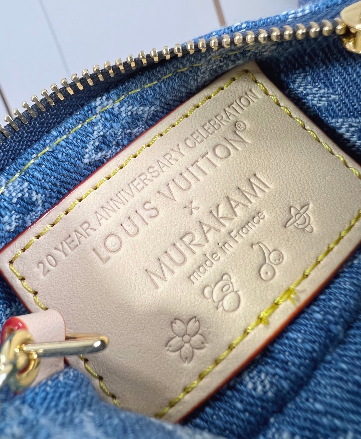 Louis Vuitton x TM Pochette con catenella