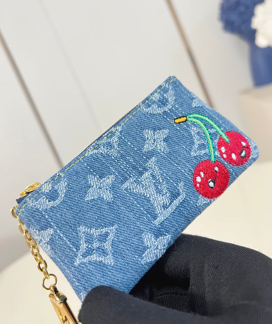Louis Vuitton x TM Pochette con catenella